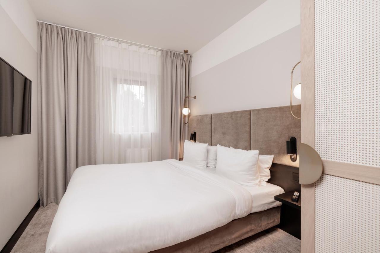 Royal Tulip Sand كولوبرزيغ المظهر الخارجي الصورة A bedroom at the hotel